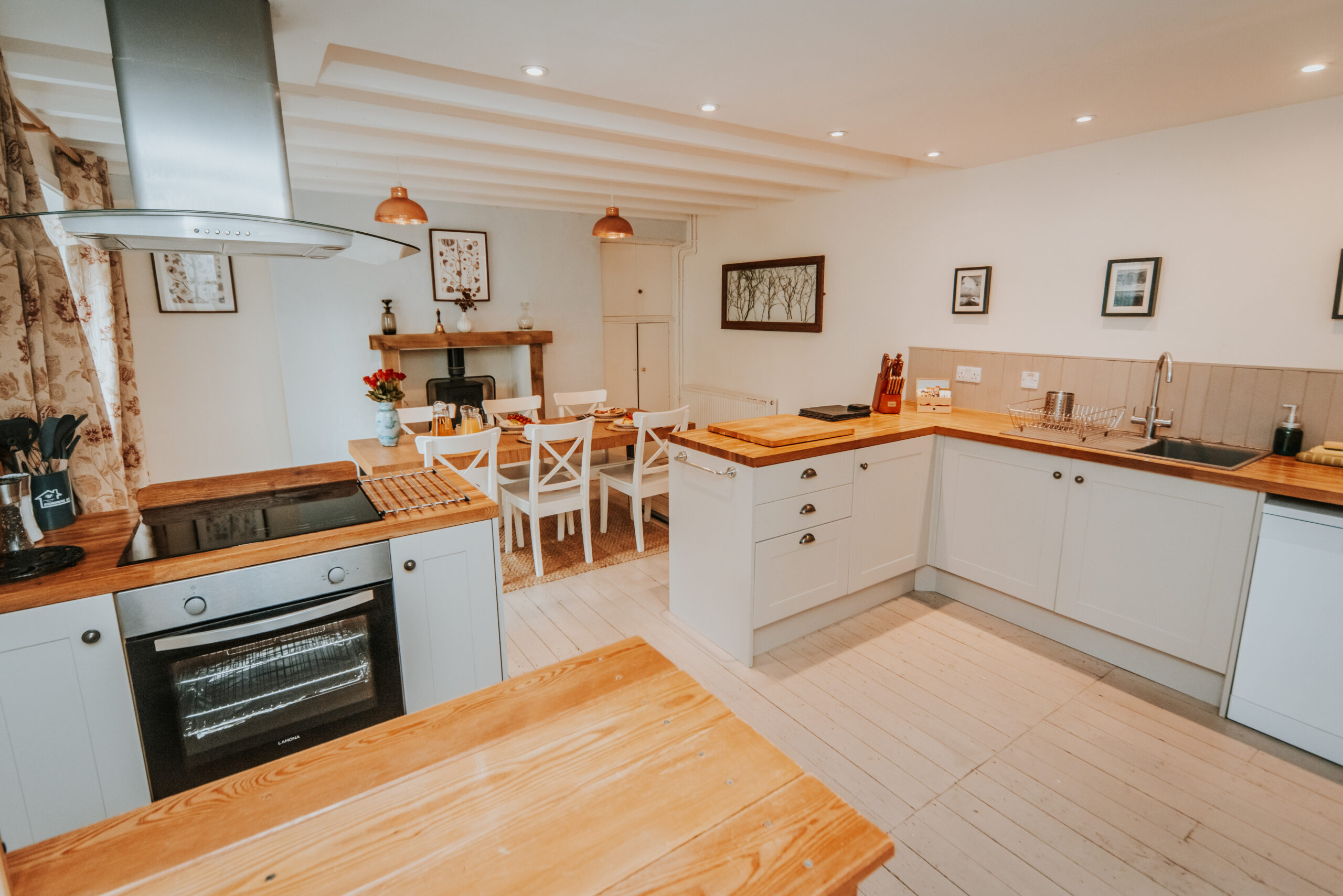 The Kitchen Contains Fan Oven, Induction Hob, Dishwasher, Microwave, Washer Dryer And Fridge Freezer.